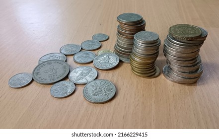 Foreign Currency Coins On The Table.