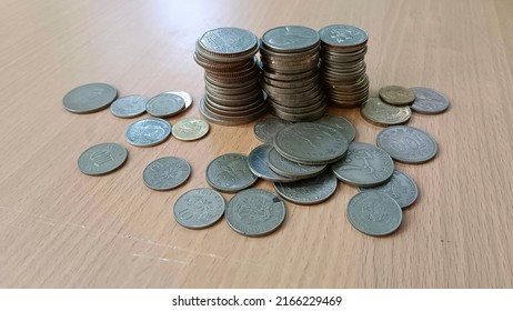 Foreign Currency Coins On The Table.