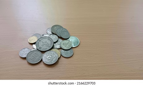 Foreign Currency Coins On The Table.