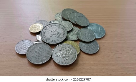 Foreign Currency Coins On The Table.