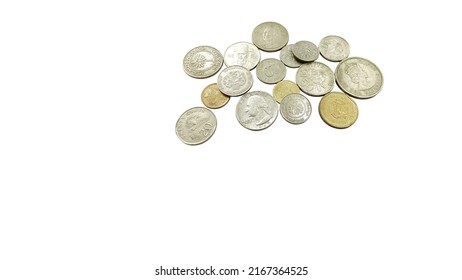 Foreign Currency Coins On A White Background.