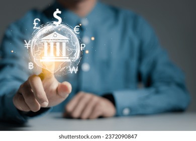 Foreign currency exchange. Businessman touching world with currency symbols dollar, euro, pound, yuan, won, bath and ruble. International money transfer or payments via online banking by fintech.