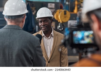 Foreign Engineer Giving An Interview To Reporter