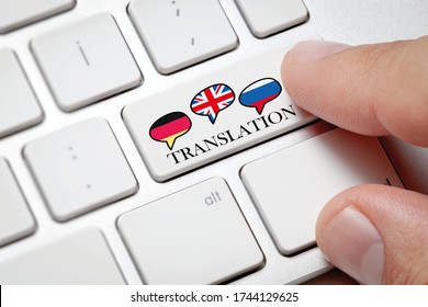 Foreign Language Translation Concept, Online Translator.Male Hand Pressing The Computer Button To Translate Foreign Languages.