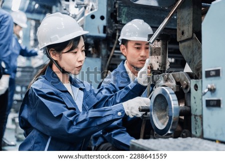 Foreign technical interns working at a factory