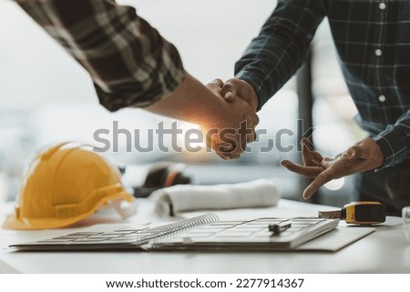 Foreman or Civil engineer handshake making modern construction. industry professional team and engineer concept