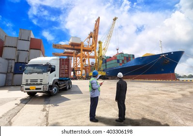 foreman control Industrial Container Cargo freight ship from his manager with working crane bridge in shipyard with truck 