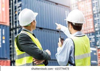 Foreman Control Industrial Container Cargo Freight Ship From His Manager With Working Crane Bridge In Shipyard With Truck