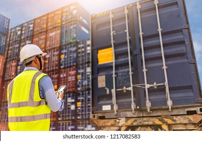 Foreman control loading Containers box to truck for Logistic Import Export Background, Business logistic concept, import and export concept - Shutterstock ID 1217082583
