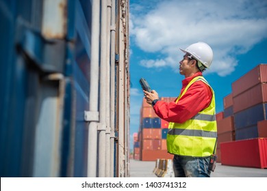 Foreman control loading containers box from cargo freight ship for import export, Foreman control industrial container cargo freight ship, Business logistic concept, Import and export concept 