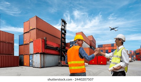 Foreman control loading Containers box from Cargo freight ship for import export  