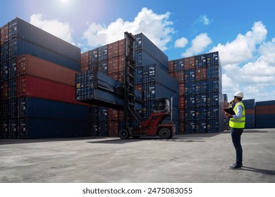 Foreman control loading Containers box from Cargo freight ship for import export. Logistic Concept - Powered by Shutterstock