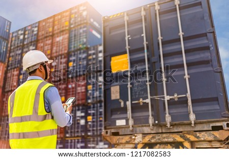Foreman control loading Containers box to truck for Logistic Import Export Background, Business logistic concept, import and export concept