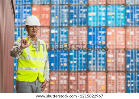Foreman controling container boxes at Cargo freight shipping for import export, cargo for logistic Industrial, selective focus, copy space 