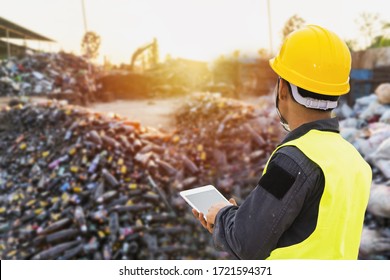 Foreman controls the recycle waste separation of recyclable waste plants. Waste plastic bottles and other types of plastic waste. - Shutterstock ID 1721594371