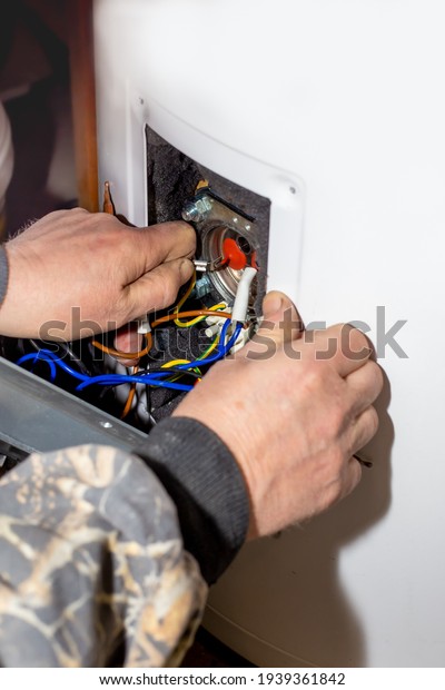 The foreman\
disassembled the electric boiler for repair and maintenance. Heater\
control relay.