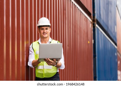 Foreman holding document, walking and checking the containers box from cargo ship for export and import