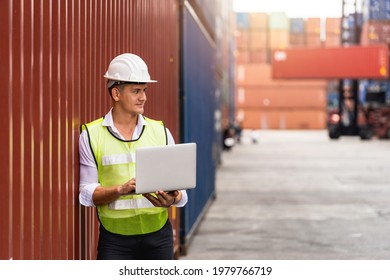 Foreman holding document, walking and checking the containers box from cargo ship for export and import