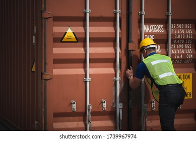 Foreman is opening the container door to inspect the goods inside the container, business for international shipping by plane and container ship.