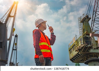 Foreman, Supervisor, Worker, Loading Master In Works At Job Site, Control To The Teamwork By Walkie Talkie Radio For Job Done In The Same Direction, Working At Risk And High Level Of Insurance