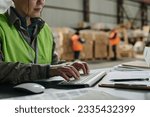 Foreman typing document on computer
