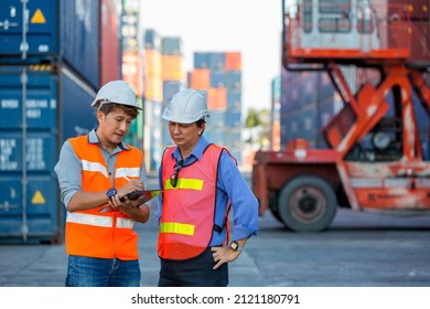 Foreman or worker work at Container cargo site check up goods in container. Foreman or worker checking on shipping containers. Logistics and shipping.	