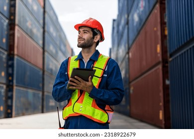Foreman or worker work at Container cargo site check up goods in container. Foreman or worker checking on shipping containers. Logistics and shipping	
