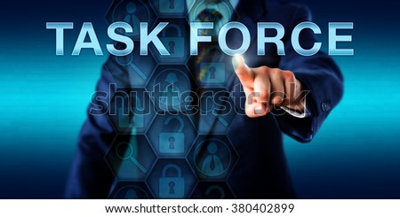 Forensic expert is pressing TASK FORCE on a touch screen interface. Business metaphor and law enforcement technology concept. Icons onscreen refer to peer experts, investigative tools and coding.
