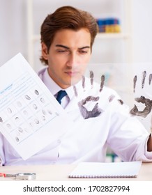 Forensic Expert Studying Fingerprints In The Lab