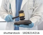 Forensic medicine, science or criminalistics legal investigation or medical practice - malpractice justice concept with judge gavel in hands of lab scientist or doctor for criminal and civil law