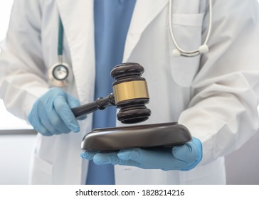 Forensic Medicine, Science Or Criminalistics Legal Investigation Or Medical Practice - Malpractice Justice Concept With Judge Gavel In Hands Of Lab Scientist Or Doctor For Criminal And Civil Law