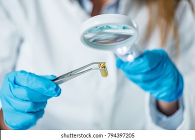 Forensic Scientist Examining Bullet Casing