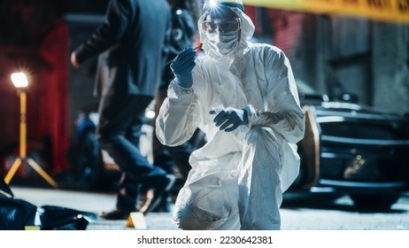 Forensics Specialist Finding Bullet Shell on Crime Scene at Night. Expert Determining Potential Cause of Death While Bagging a Cartridge and Zipping it as Evidence. for Documentary