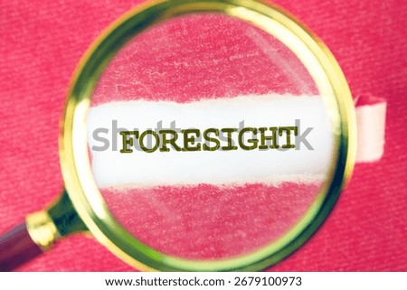 FORESIGHT word was found using a magnifying glass under a piece of paper. Business, Technology, Internet and network concept
