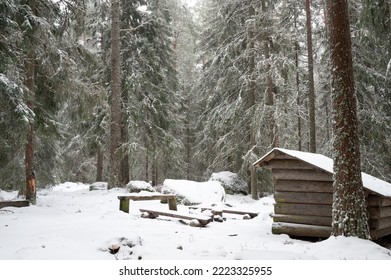 Forest Cabin With Fire Place On A Snowy Winter Day