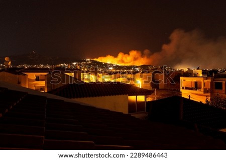 Forest Fire at Night.Wildfire burning forest trees in the mountain.Wildfires caused by humans. Penteli. Greece.
