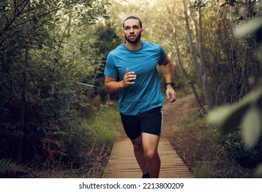 Forest, Fitness And Runner Man Training For Marathon On Trail Path In Mexico With Concentration. Cardio, Workout And Goals Of Guy Practicing Running Speed For Athlete Competition With Focus.