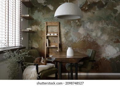 Forest Green Interior Of Dining Room Design With Solid Oak Wooden Table, Oak Shelf And Green Chairs, Bengal Cat, Concrete Vase, Elegant Cement Accessories, Recycled Paper Lamp Shade And Clay Wall