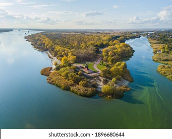 Forest Or Grove On Cape Between Two Rivers. Aerial View.