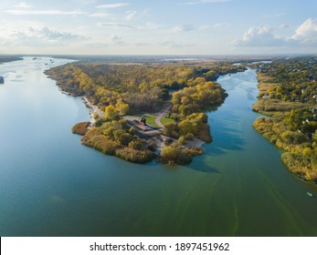 Forest Or Grove On Cape Between Two Rivers. Aerial View.