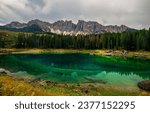 Forest lake in the mountains. Mountain lake landscape. Forest lake in mountains. Mountain lake in forest