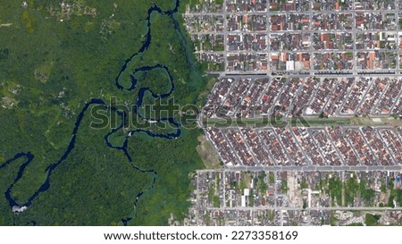 Forest, river and city border, forest and city separated by zigzag line, looking down aerial view from above – Bird’s eye view forest and city border Vila Caiçara, Praia Grande - Sao Paulo, Brazil	