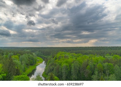 Forest, river and rain clouds