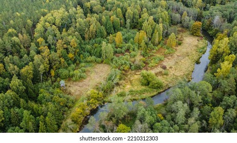 Forest And River At Sunset In Autumn. Aerial View Of Wildlife In Latvia, Europe