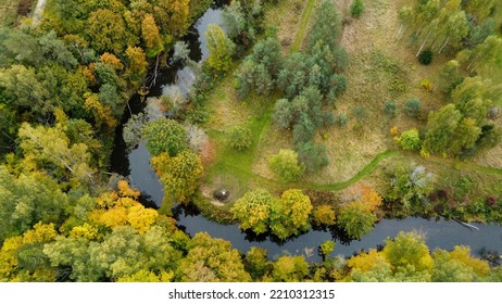 Forest And River At Sunset In Autumn. Aerial View Of Wildlife In Latvia, Europe