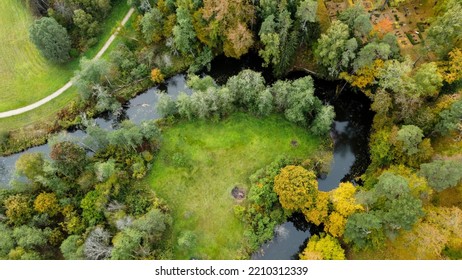 Forest And River At Sunset In Autumn. Aerial View Of Wildlife In Latvia, Europe