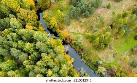 Forest And River At Sunset In Autumn. Aerial View Of Wildlife In Latvia, Europe