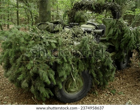 Forest, war and an army vehicle in camouflage for an attack or ambush during a special forces mission. Nature, military and a car covered in grass in the countryside for training as a soldier Stock foto © 