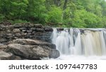 Forest waterfall on old Magarge Dam, Green Valley, Wissahickon, Philadelphia in the beginning of May.