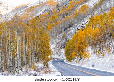 Forest yellow trees covered in snow in Aspen, Colorado maroon bells mountains in October 2019 and vibrant foliage autumn along road - Powered by Shutterstock